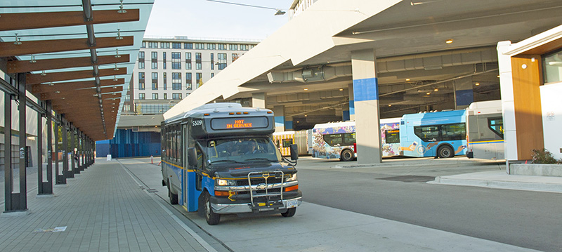A shuttle bus is parked at UBC bus exchange