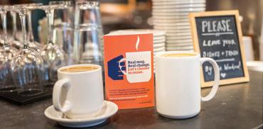 Coffee in enamel coffee cups at a cafe